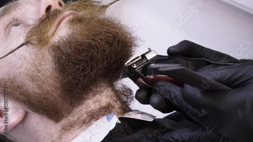 Men's hairstyling and haircutting in a barber shop or hair salon.