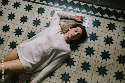 Woman sleeping on a floor