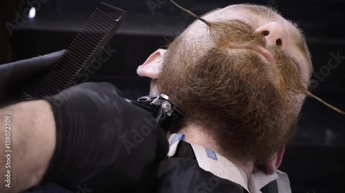 Men's hairstyling and haircutting in a barber shop or hair salon.