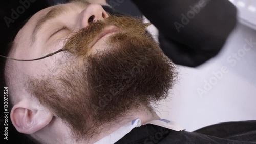 Men's hairstyling and haircutting in a barber shop or hair salon.