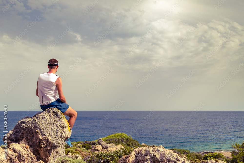 Man looking at beautiful ocean view, relaxing