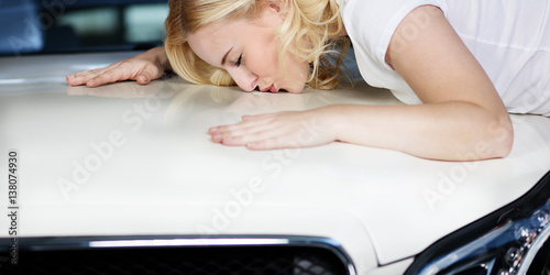 Woman loves and cherishes her car photo