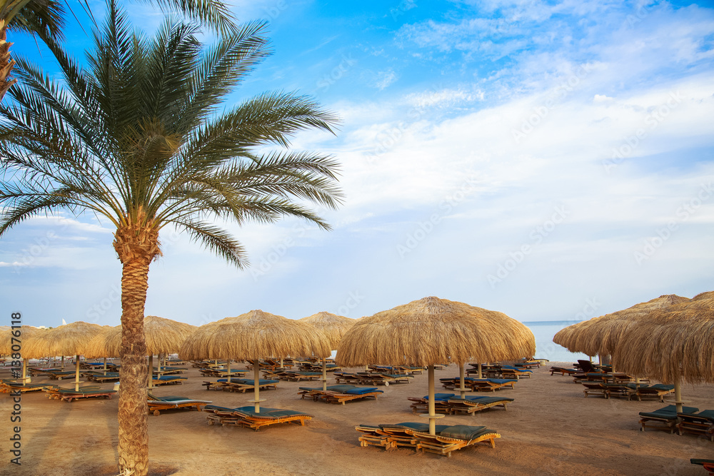 Beautiful empty resort beach at sunset time. Horizontal color image.