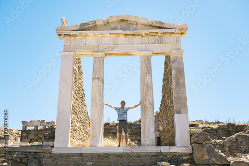 Greece, Mykonos, Delos, tourist visiting the Temple of Isis photo