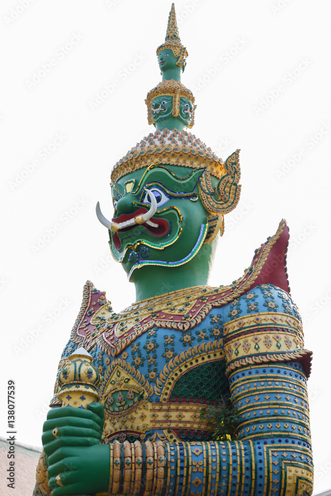 standing giant guard statue in The Emerald Buddha temple in Bangkok, Thailand