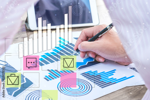 business statistics success concept : businessman analytics chart and graph