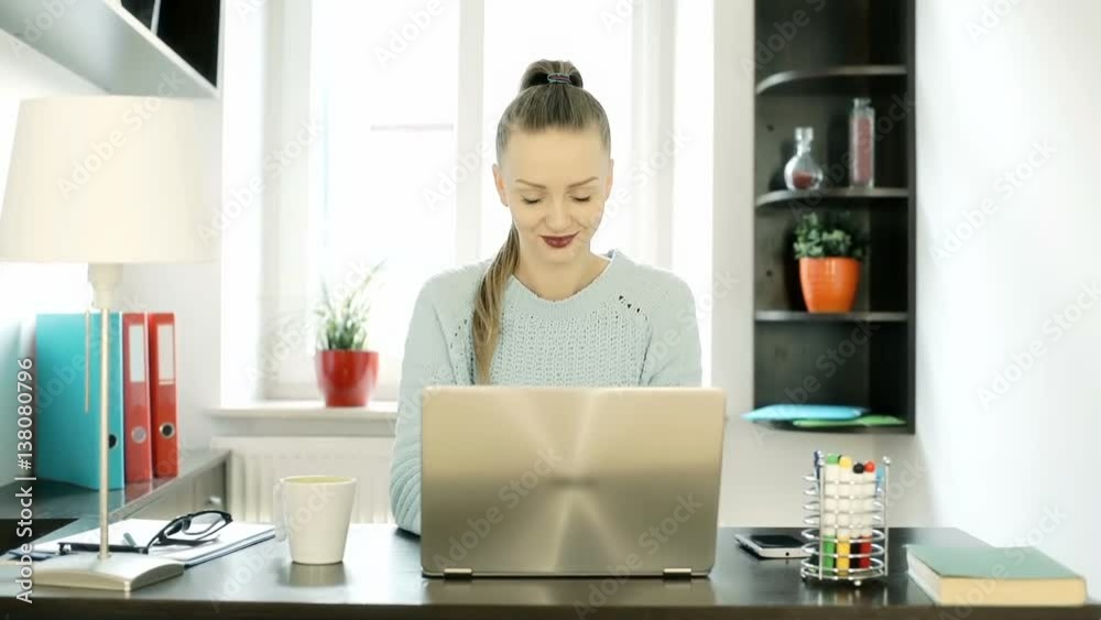 Beautiful woman working on her new, modern laptop in the office at home, steadycam shot
Beautiful woman working on her new, modern laptop in the office at home, steadycam shot
