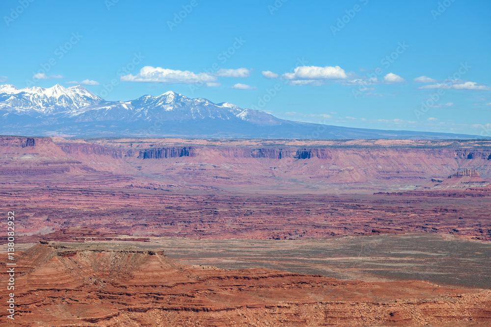 This image was captured in the Island of the Sky District of the Canyonlands National Park in Utah. Snow capped Manti La Sal Mountains in background.