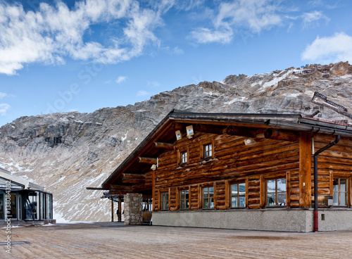 Wooden alpine cafe at Zugspitze, Bavarian Alps. Popular ski resort in Bavaria. Rack railway station.