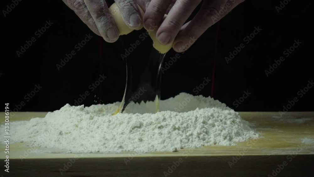 Super slow motion cook breaks egg Super slow motion cook breaks egg