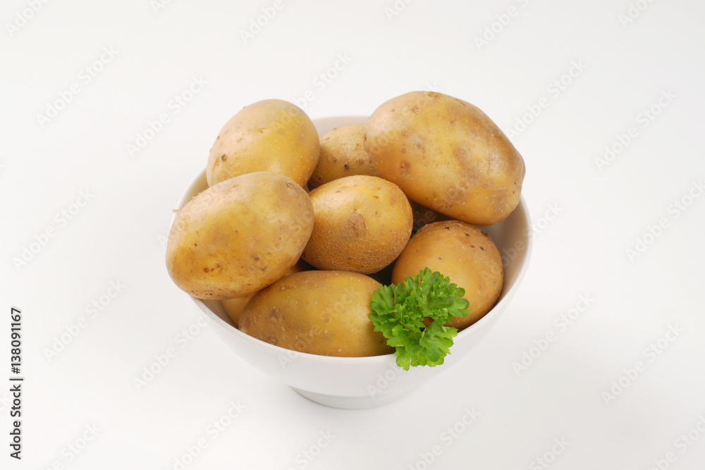 raw unpeeled potatoes raw unpeeled potatoes