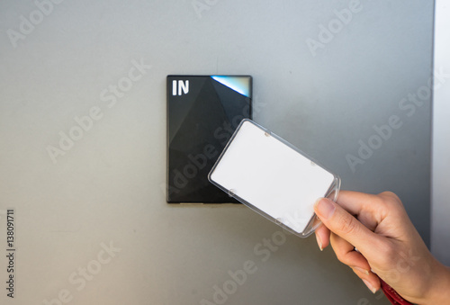 Asian business man hand holding Access card / Key Card eletronic door accessing control scanning to lock and unlock door. Security scan door open / close Automatic Technology system concept