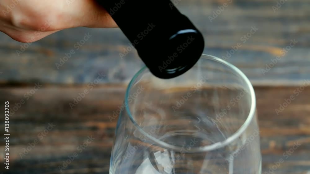 custom made wallpaper toronto digitalPouring white wine into wine glass. Closeup of wineglass and bottleneck against wooden background.