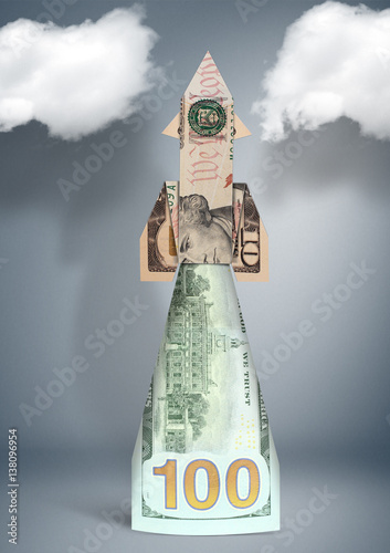 financial success concept, sartup rocket made of money photo