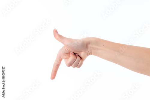 woman's hand with the index finger of the flaps lowered isolated on white background © ponomarencko