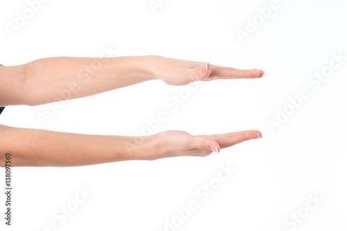 two female hands outstretched toward the one opposite the other isolated on white background