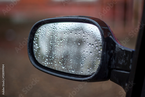 Rain Drops on a Mirror of the Car