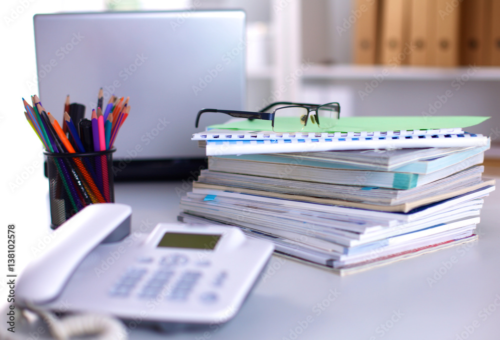 Group of multicolored office folders and glasses Group of multicolored office folders and glasses