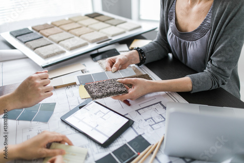 An interior designer consults with clients