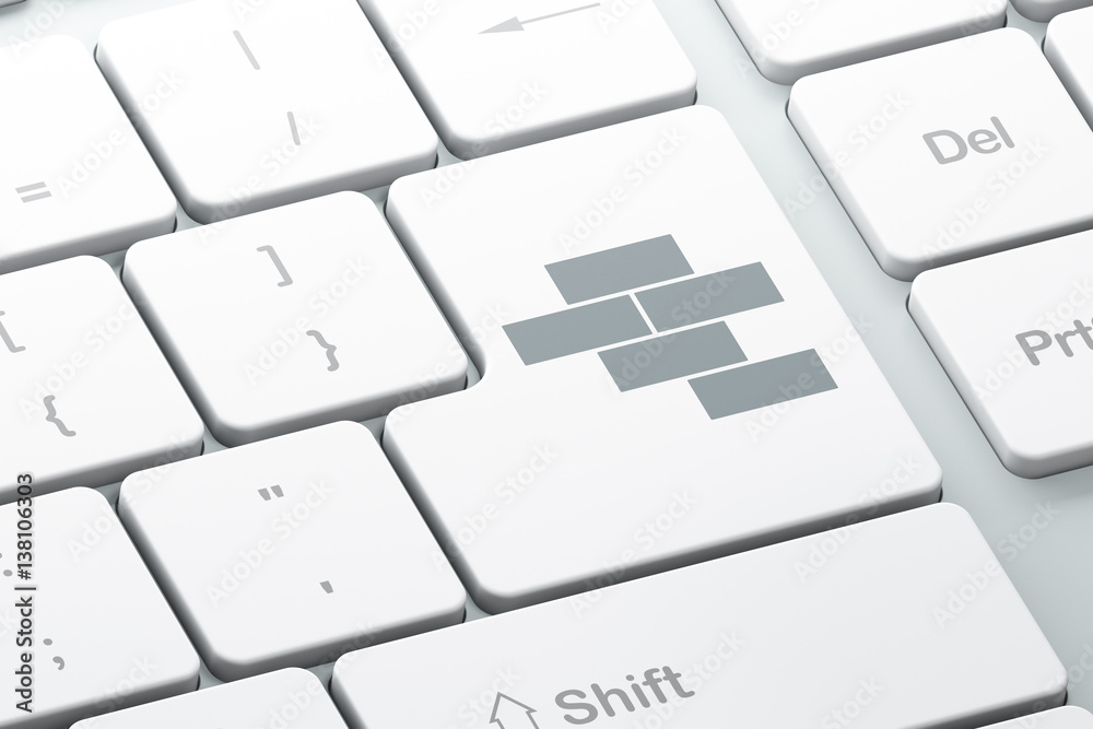 Building construction concept: Bricks on computer keyboard background Building construction concept: Bricks on computer keyboard background