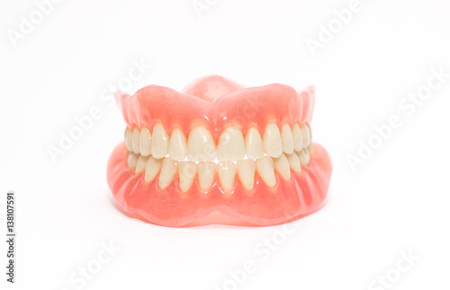 Two acrylic dentures ,white background. photo