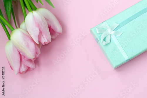 Pink tulips on the pink background with gift box. Flat lay, top view. Valentines background © patho1ogy