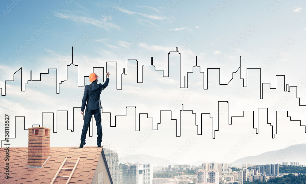 Man architect draw silhouette of modern city on blue sky. Mixed Man architect draw silhouette of modern city on blue sky. Mixed