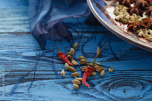 Orient table with cpices on blue table photo