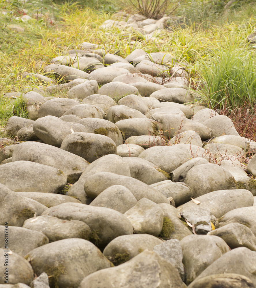 Path of granite stones boulders green grass just grows Path of granite stones boulders green grass just grows