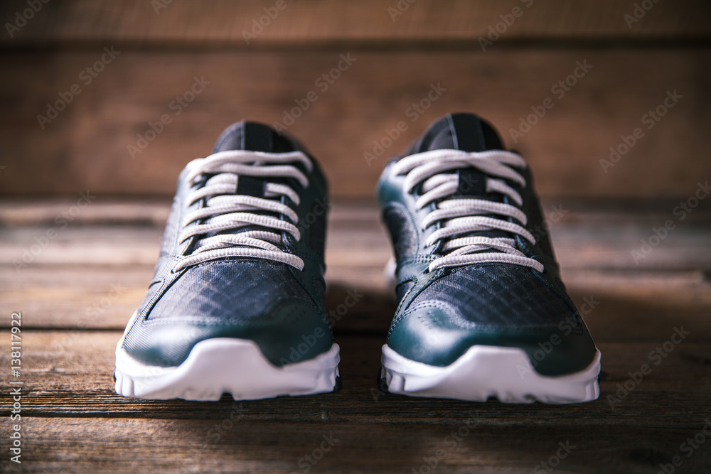 running shoes on a wooden background. sport