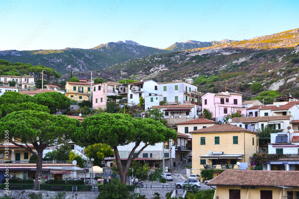 Small village with colourful houses on seaside of Elba island, Italy