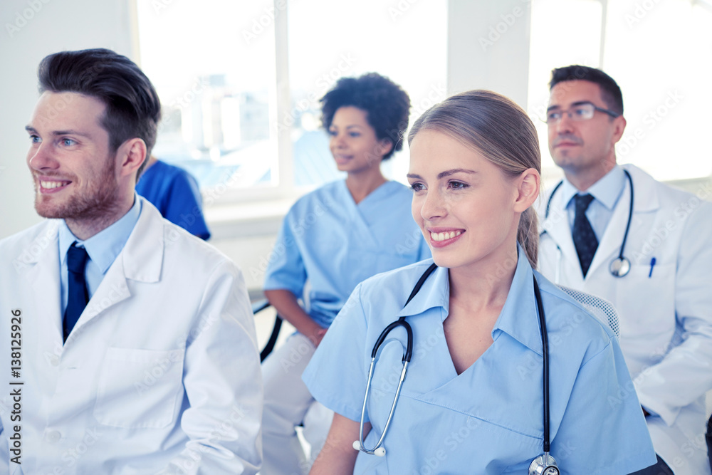 group of happy doctors on seminar at hospital group of happy doctors on seminar at hospital