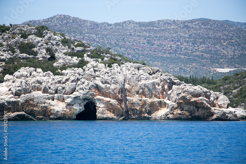 Sea cave in bay of Uchagiz in Mediterranean turkey photo