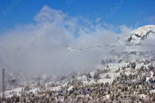 This is view of the mountains and the clouds from the top of the mountain Zelenaya, ski resort Sheregesh, Russia.