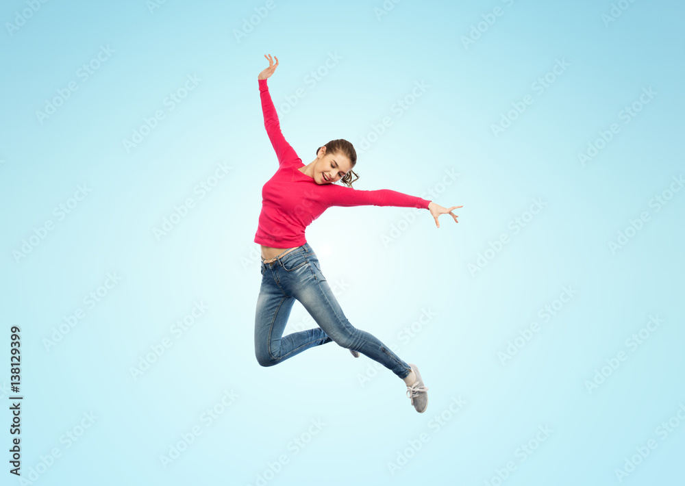 happy young woman jumping in air or dancing happy young woman jumping in air or dancing