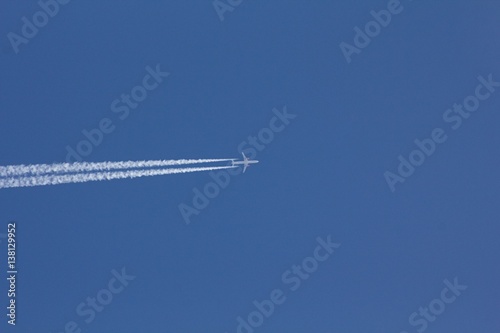 Airplane on the blue sky. 