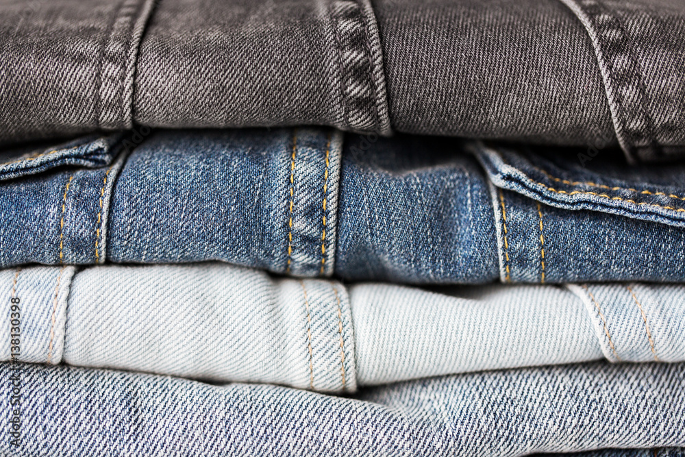 close up of denim clothes or jeans pile