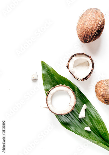 cocktail with coconut on white background top view