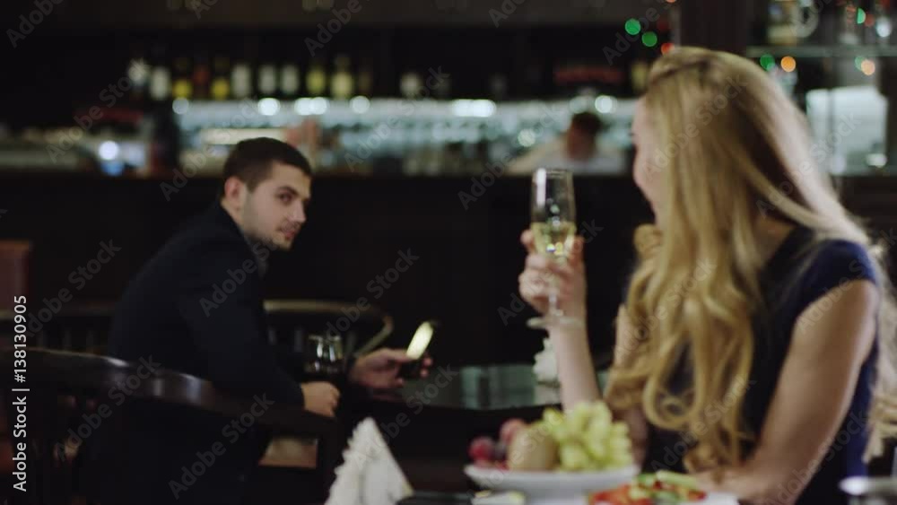 blondie flirting with a man in restaurant