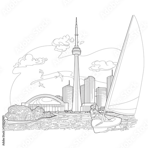 Small sail boat sailing in a river or lake in front of an island and a city skyline. A flock of birds fly by in the background.
