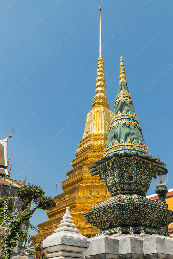 Wat Phra Kaew, Temple of the Emerald Buddha with gold pagoda and blue sky, Bangkok, Thailand