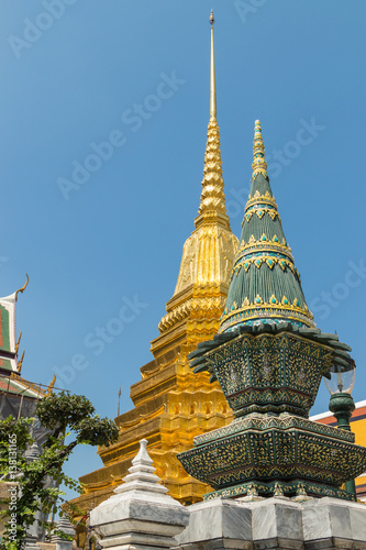 Wat Phra Kaew  Temple of the Emerald Buddha with gold pagoda and blue sky  Bangkok  Thailand