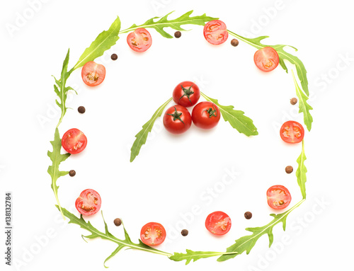 fresh vegetable, allspice, cherry tomato and arugula isolated on white