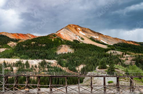 Tableau sur toile abandoned Yankee Girl mine in Colorado with storm clouds