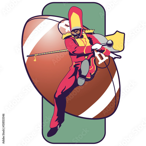 Marching band leader with baton jumping with a giant football behind him.