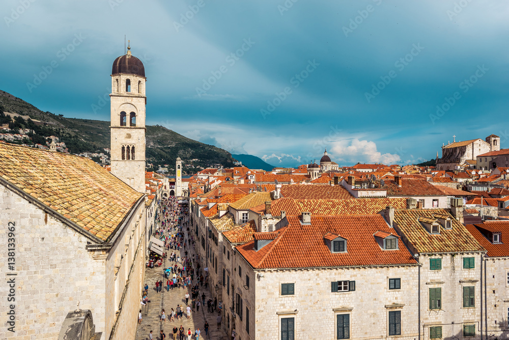 Multitude of tourists visit the Old City of Dubrovnik and the famous street Stradun