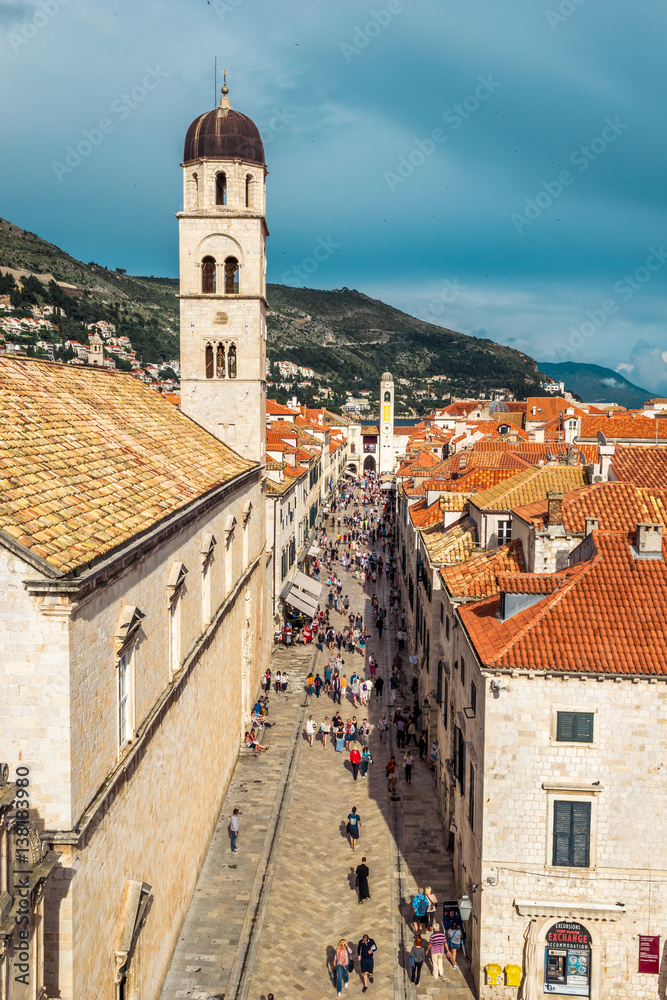 Multitude of tourists visit the Old City of Dubrovnik and the famous street Stradun