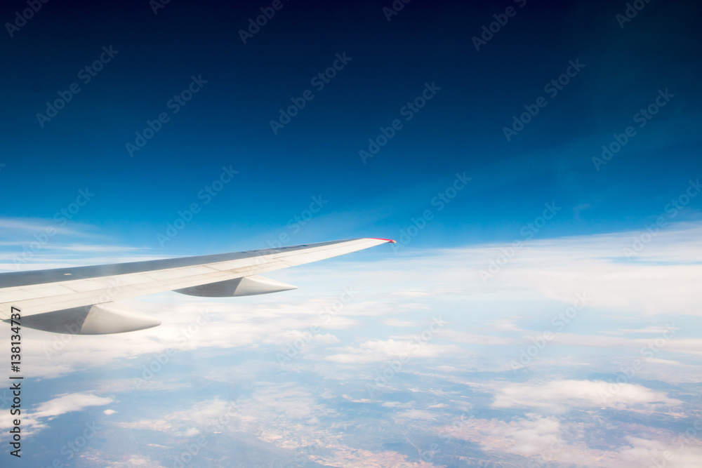 The wing of an airplane flying in the sky The wing of an airplane flying in the sky