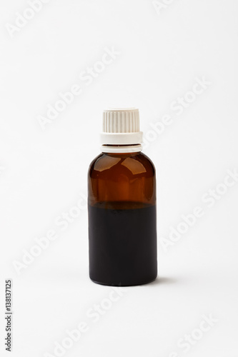 Bottle with cough medicine. White cap on brown vial. Be healthy and feel good.