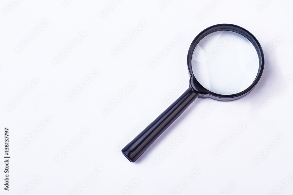 Magnifying glass in black frame. Loupe on white backdrop. Magnifying glass in black frame. Loupe on white backdrop.
